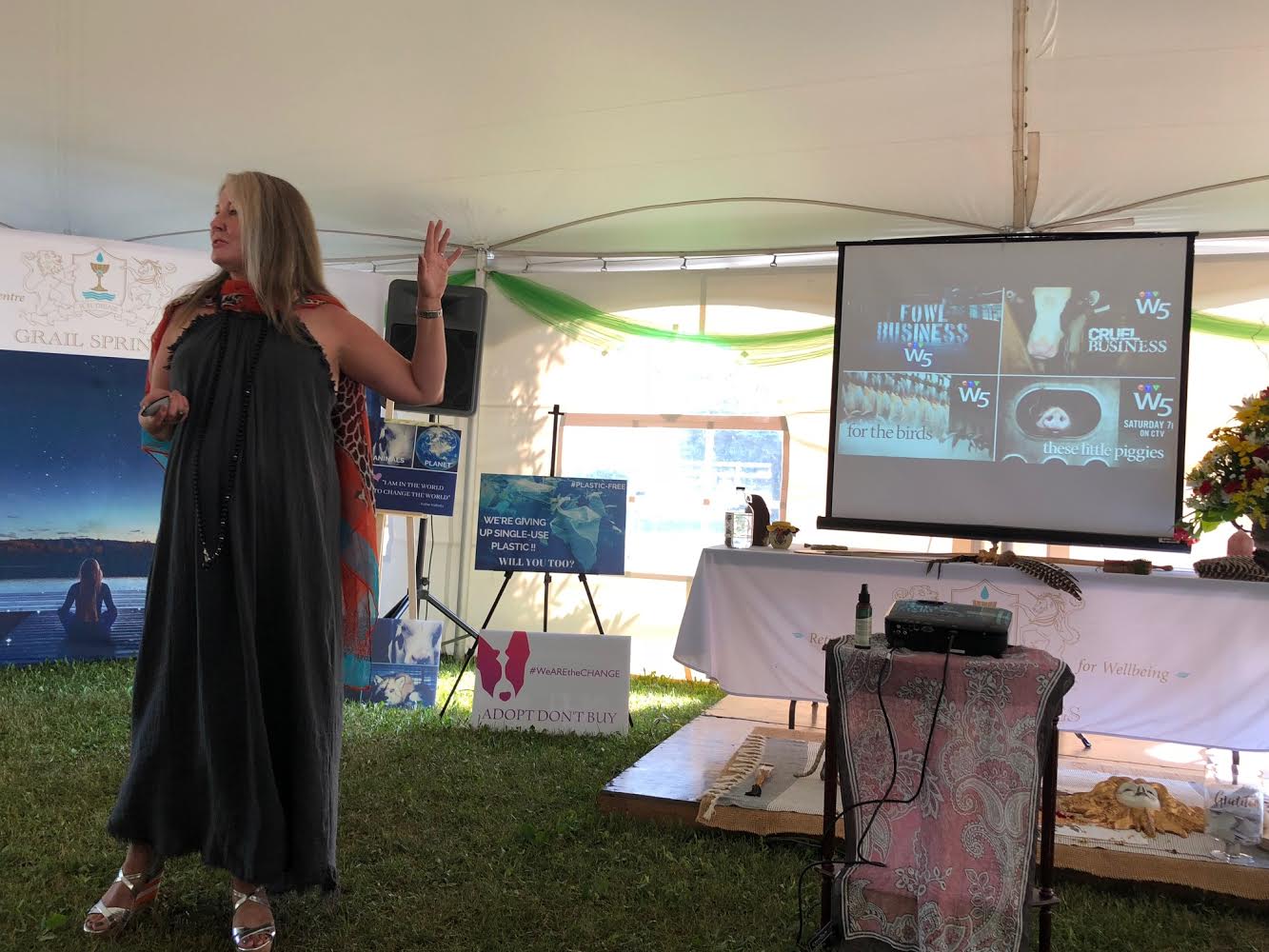 Krista presenting in a marquee at an outdoor festival